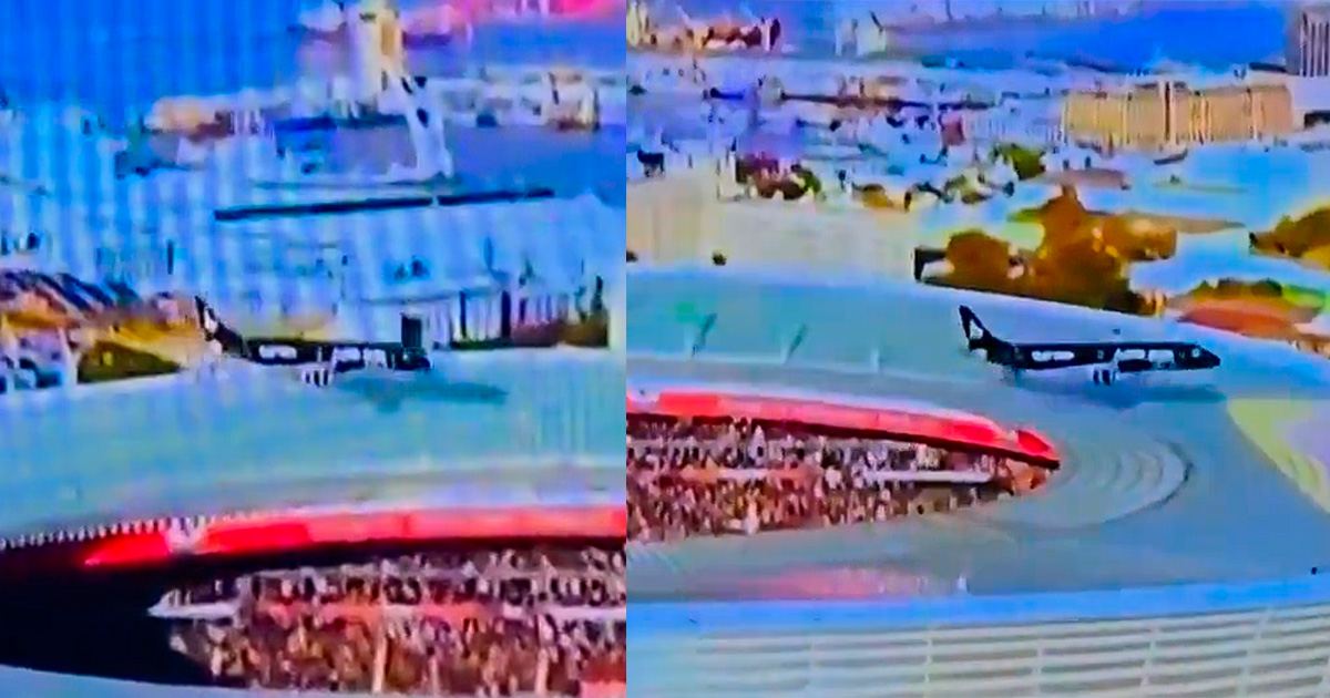 Dois aviões fazem manobra arriscada, passam de raspam no teto do estádio e povo comemora a loucura